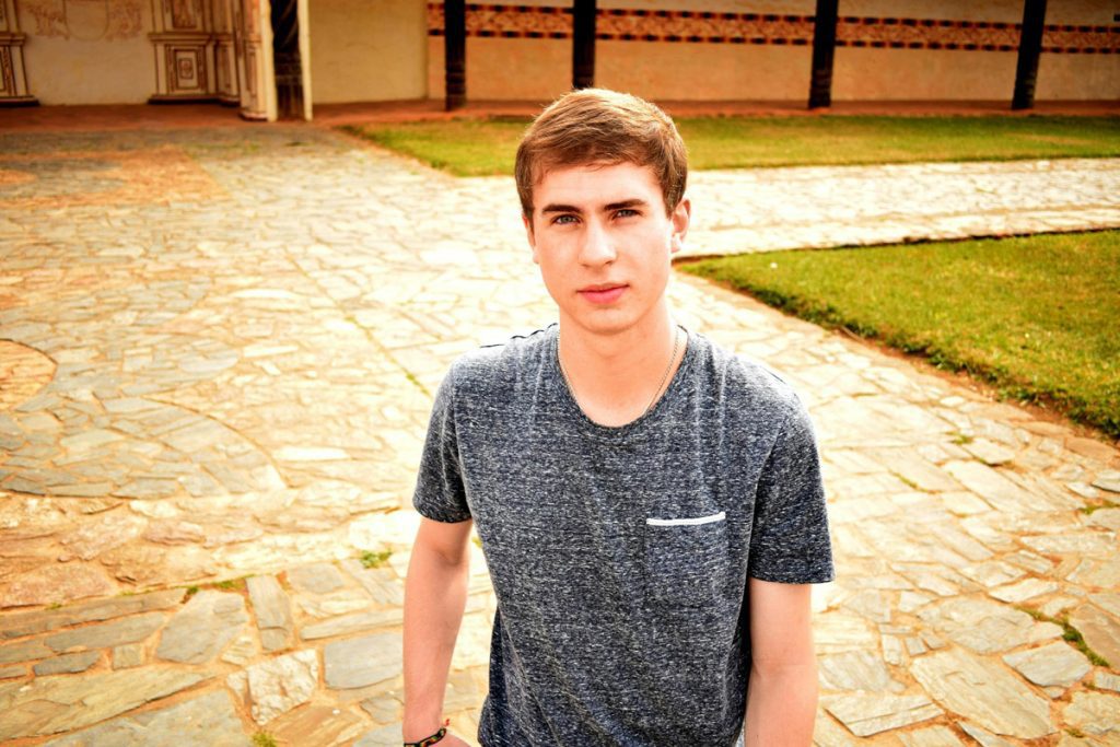 Young man walking on patio