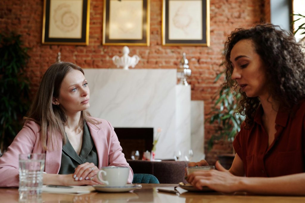 Two women talking over coffee