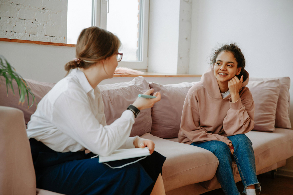 Young woman talking to a therapist