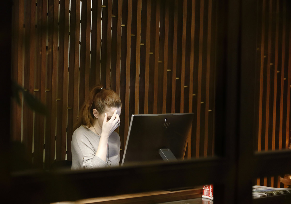 Stressed woman using laptop