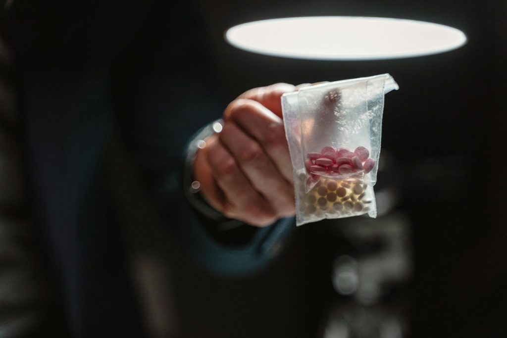 Close up of pills in plastic bags.