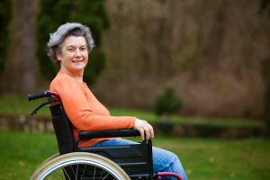 woman in courtyard in a wheelchair