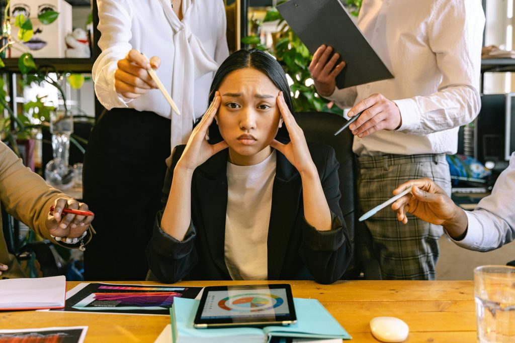 Stressed out woman in the workplace.