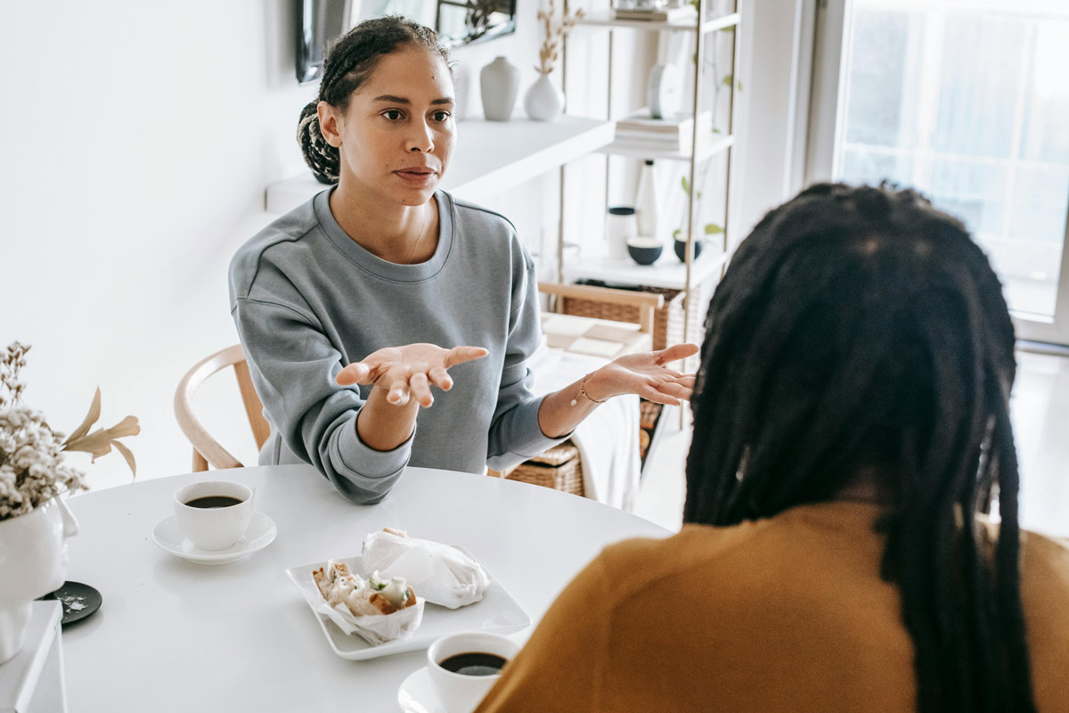 Couple have a serious talk over coffee.