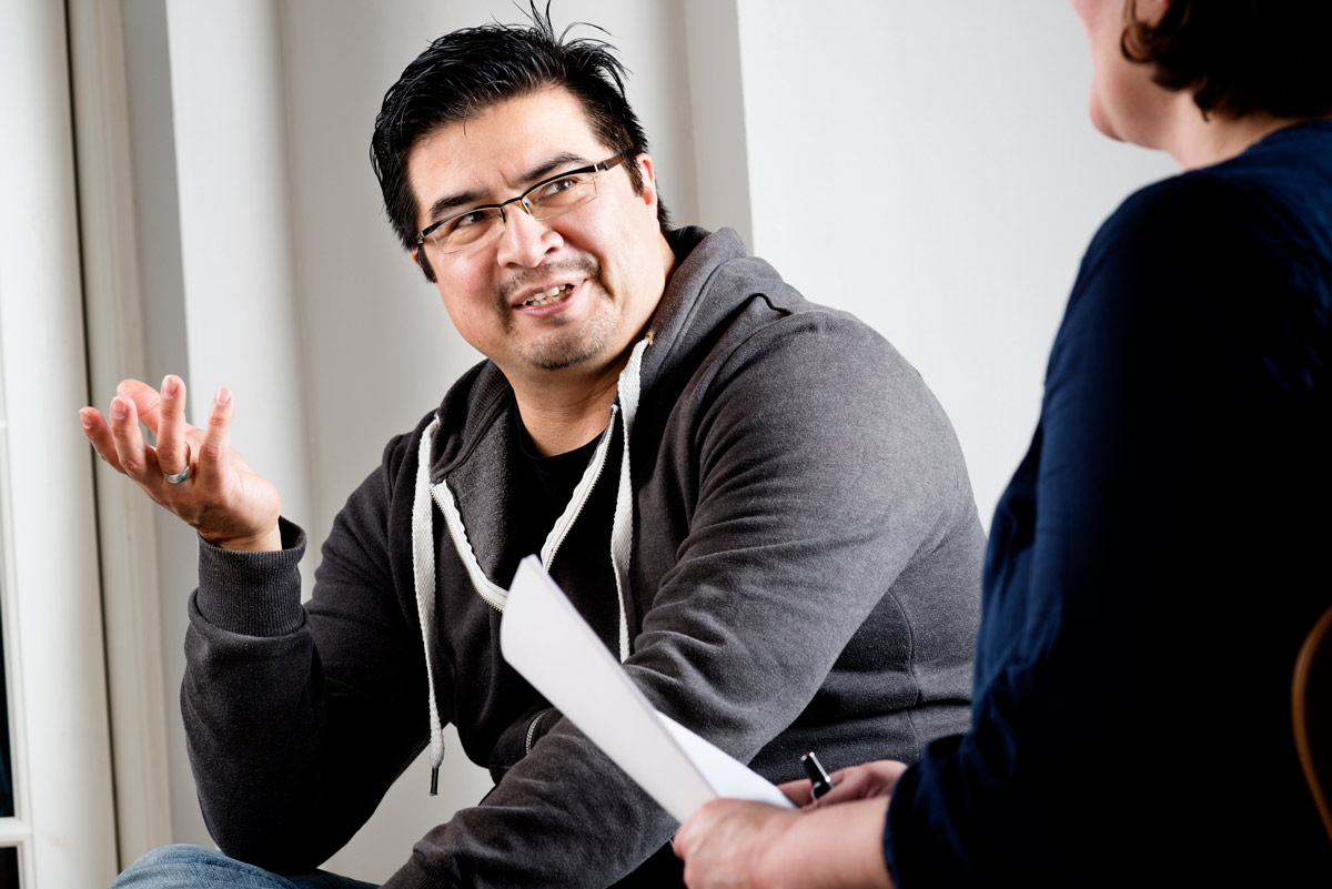 Man talking to a female counselor.