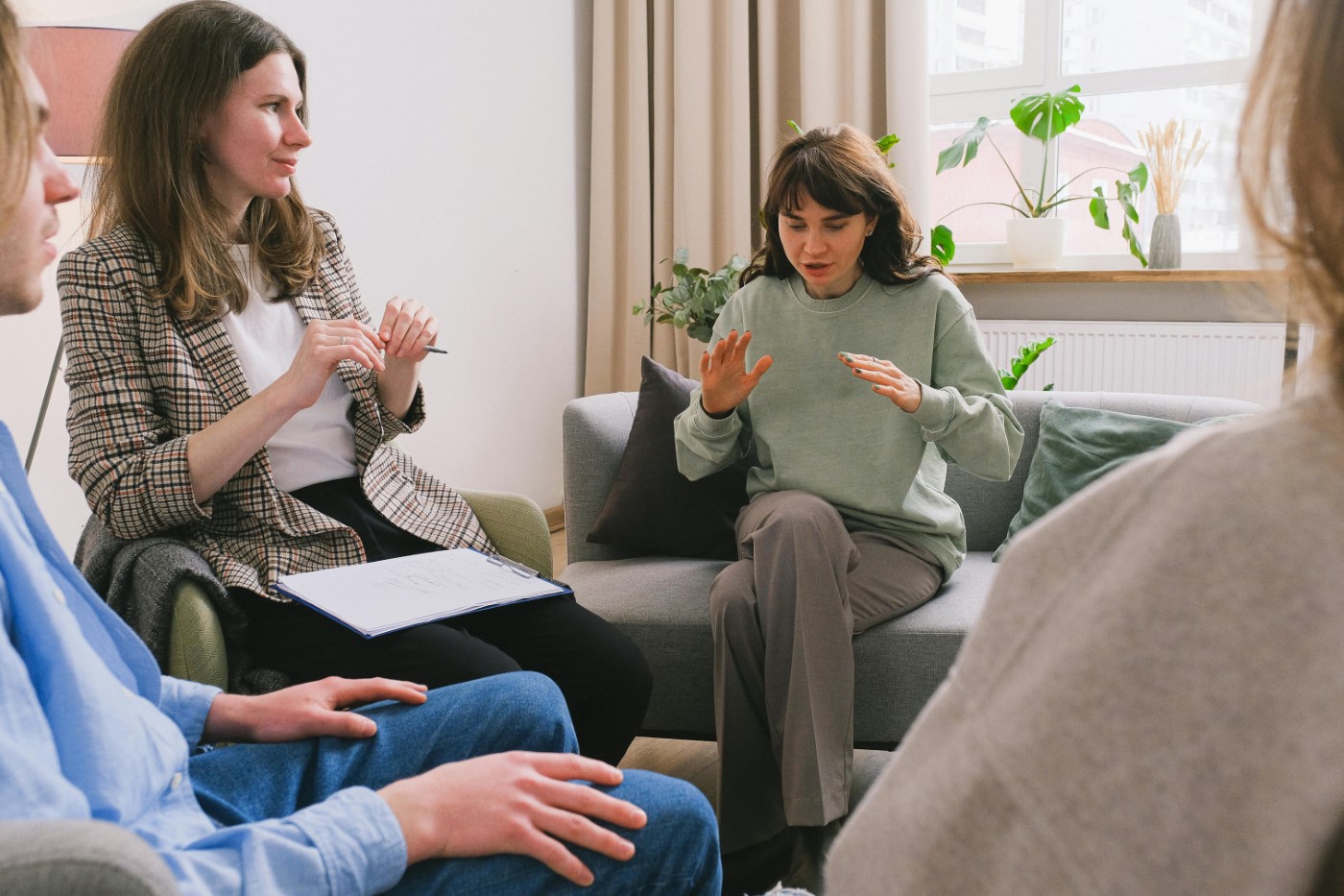 Counselor and client in group therapy session.